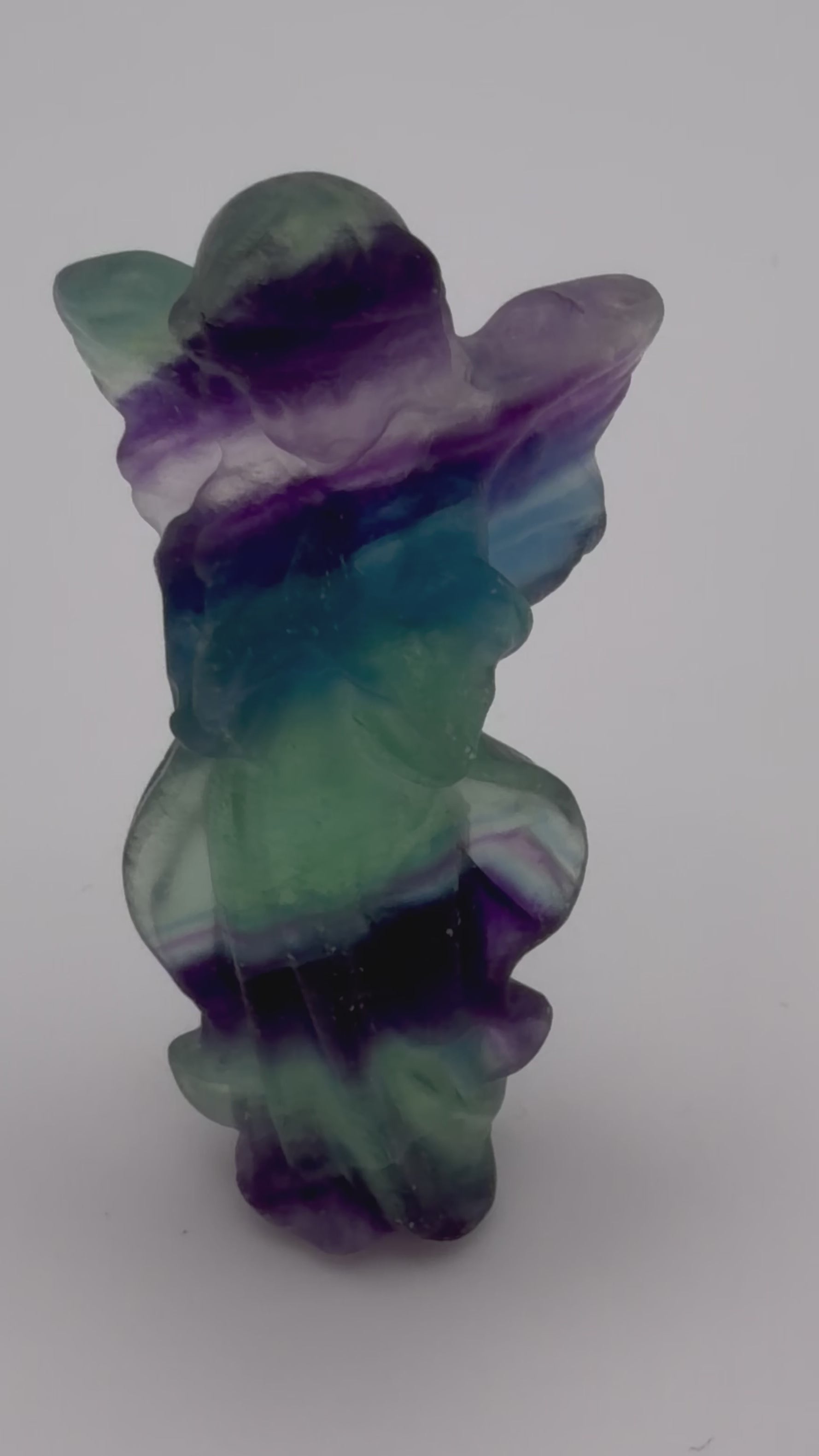 Rainbow Fluorite Angel Carving – Handheld Crystal Guardian (Green, blue & Purple Banding)