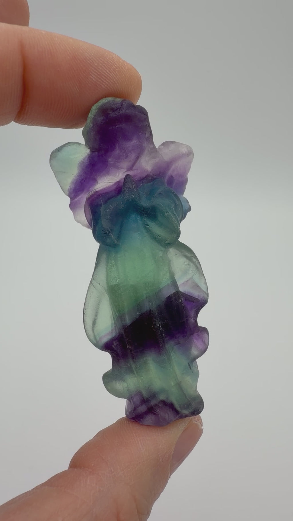 Rainbow Fluorite Angel Carving – Handheld Crystal Guardian (Green, blue & Purple Banding)